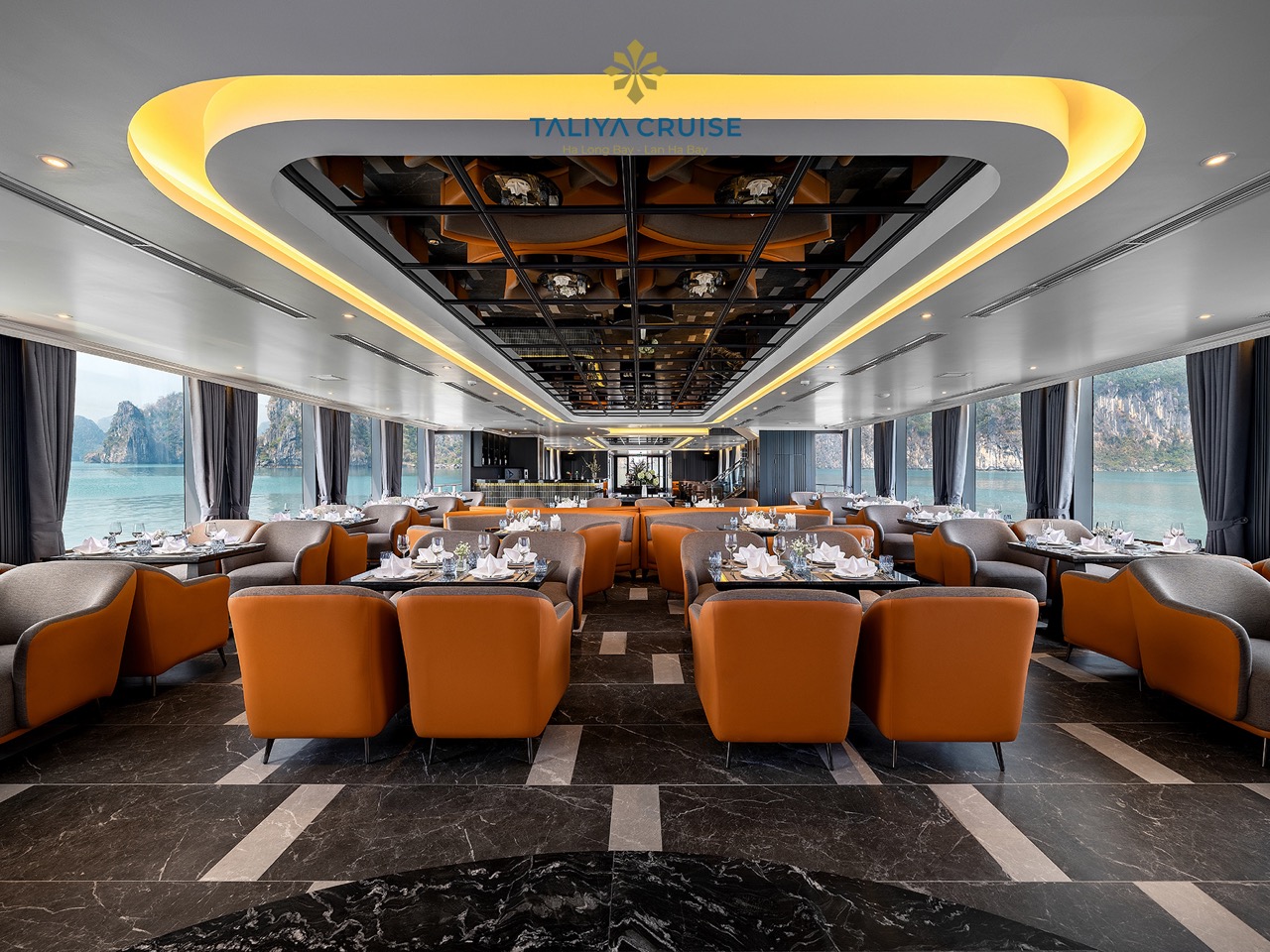 Luxurious cruise lounge with panoramic views of Halong Bay, elegant interior, perfect for relaxing d.