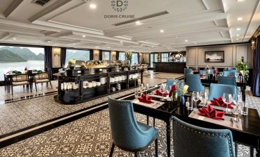 Luxurious cruise dining area with panoramic Halong Bay views, ideal for high-end travel and relaxati.