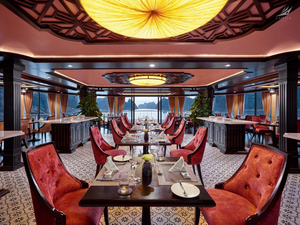 Luxurious restaurant dining room with elegant decor and scenic water views, perfect for fine dining experiences.