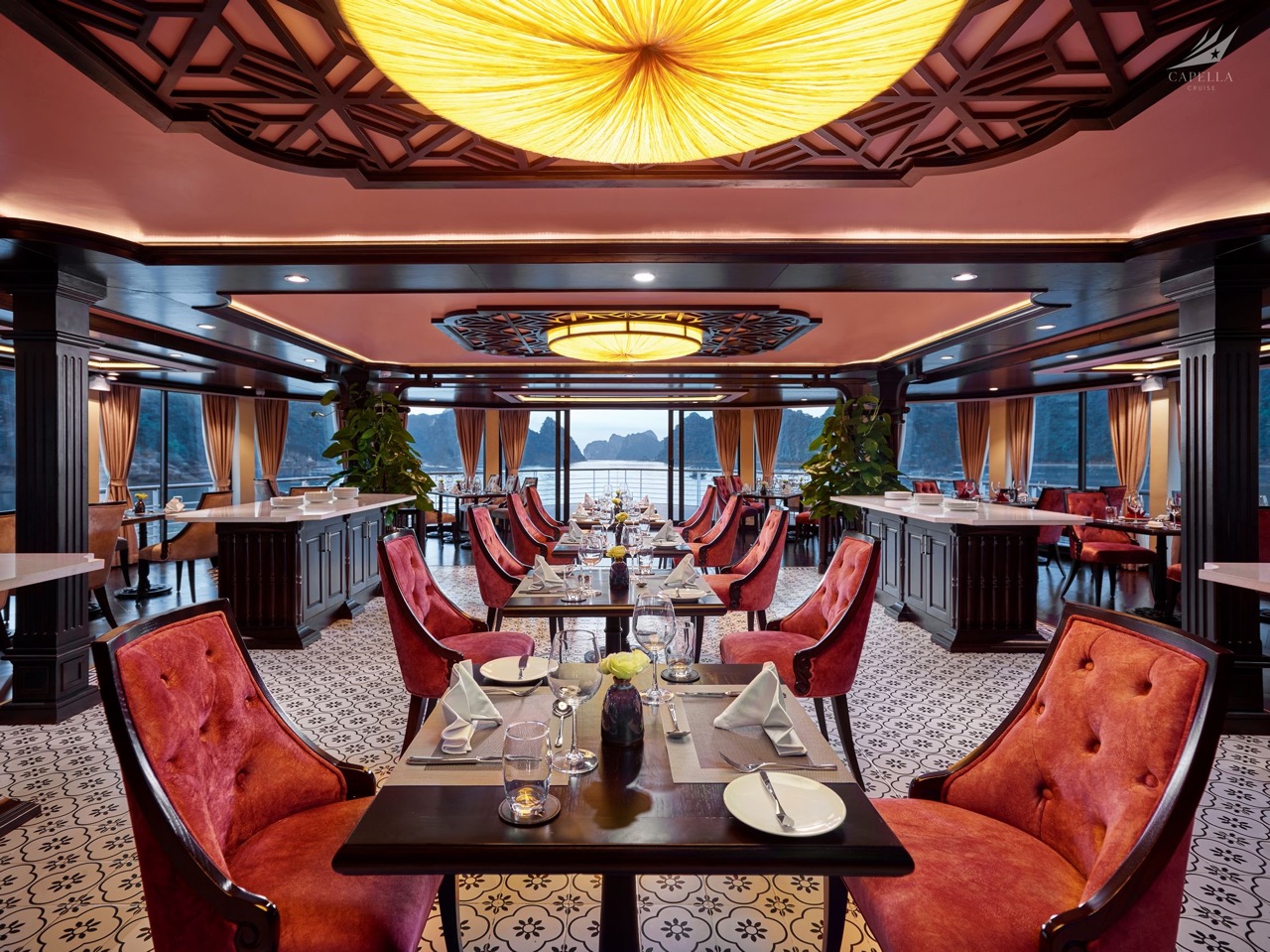 Luxurious restaurant dining room with elegant decor and scenic water views, perfect for fine dining experiences.