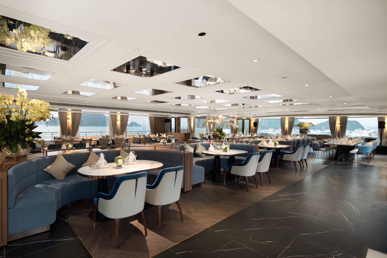 Elegant waterfront restaurant with luxurious furniture and ocean views in Vietnam.