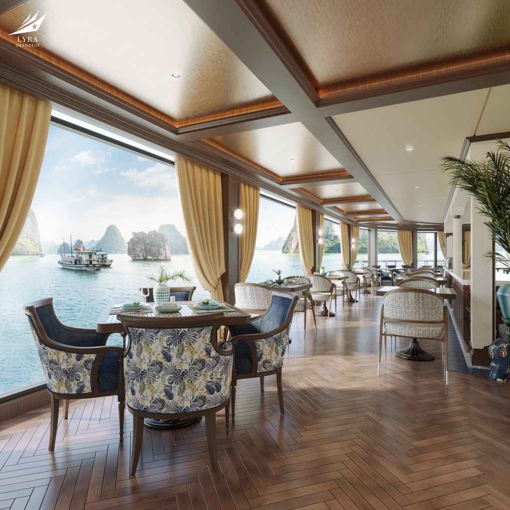 Elegant waterfront dining room with panoramic ocean views and luxurious decor at ViettrendTour.