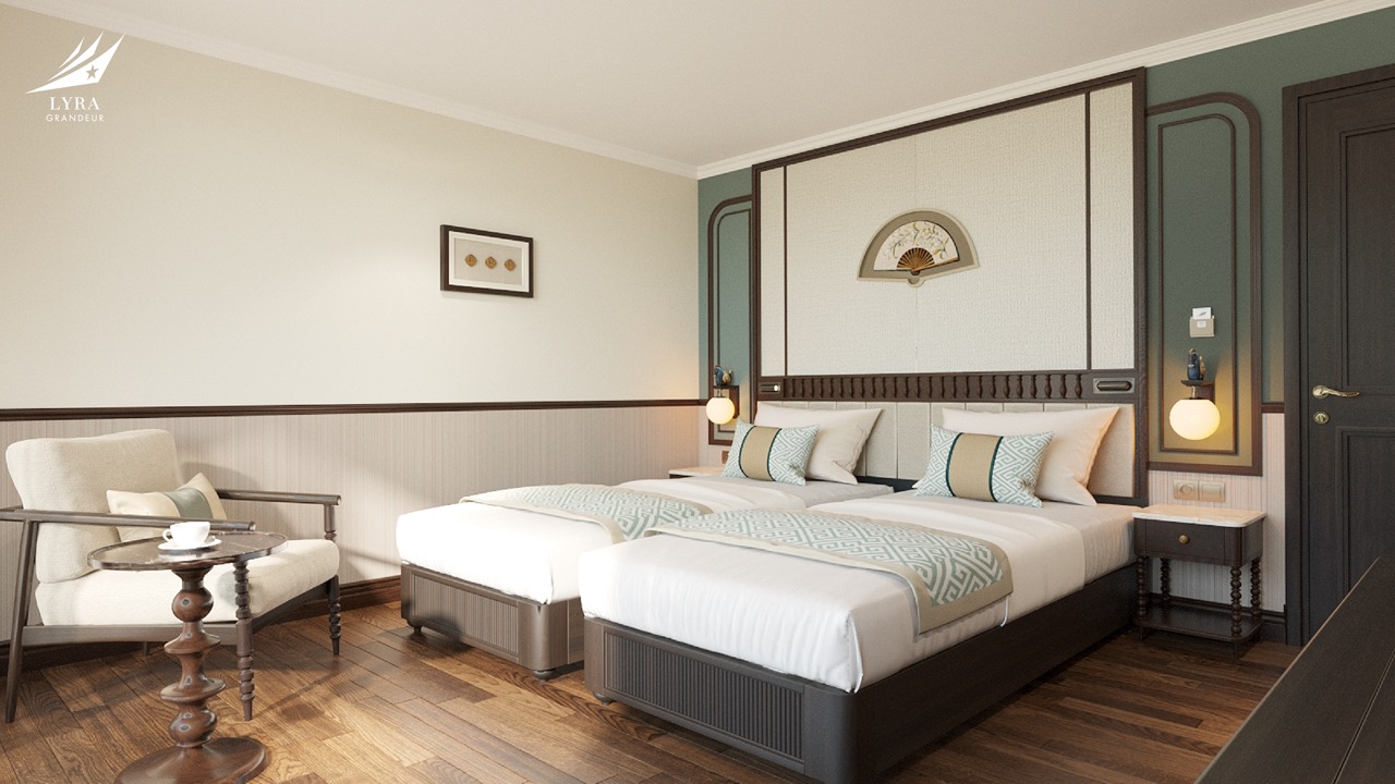 Elegant hotel bedroom with twin beds, modern decor, and cozy seating area in a luxury suite.