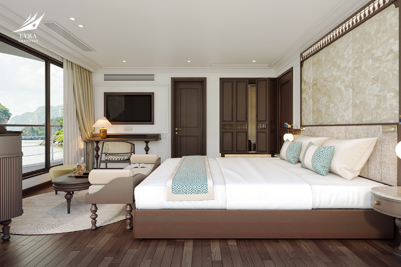Luxury hotel bedroom with sea view, modern decor, and elegant furnishings.