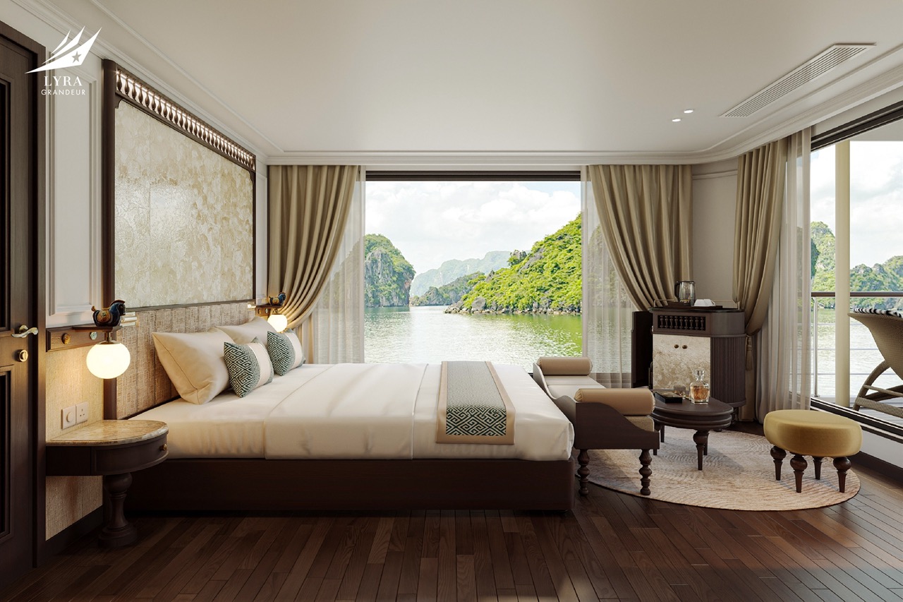 Luxurious bedroom overlooking water with scenic mountain views, elegant decor, and full-length windows.