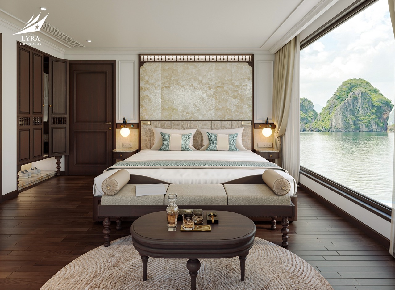 Luxurious waterfront hotel room with large window view of limestone islands, elegant decor, and comfort.