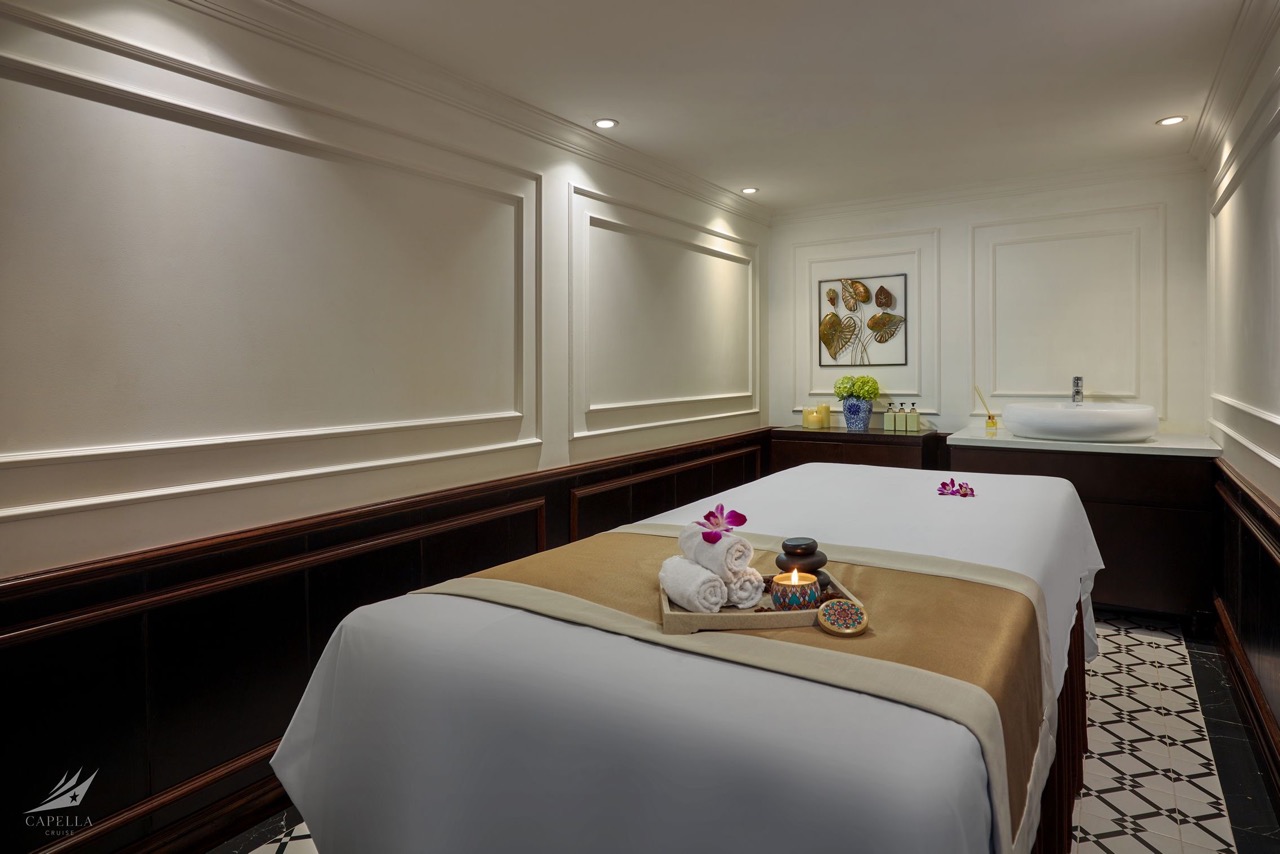 Calm spa massage room with elegant decor, soft lighting, and relaxing ambiance.