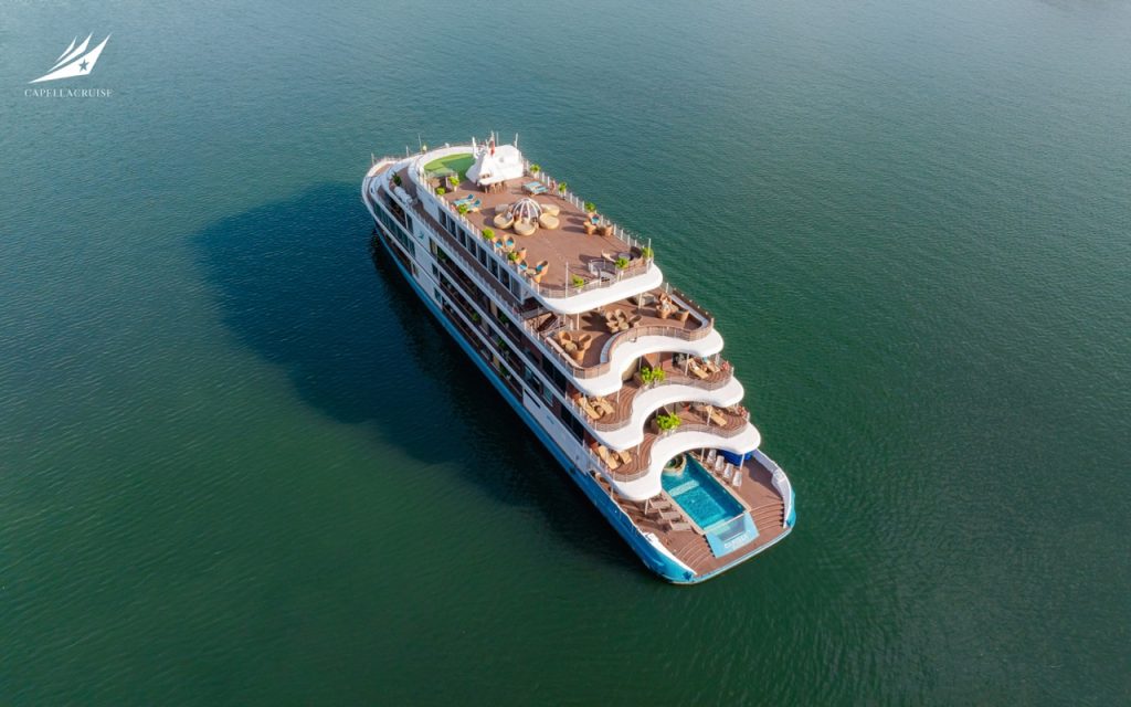 Luxury cruise ship with outdoor pools and panoramic decks for vacation travel.