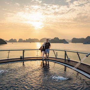 sundeck-couple-sunset-pool-view-stellar-of-the-seas-lan-ha-bay-viettrendtour