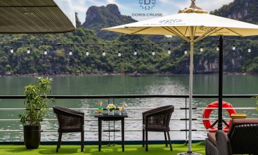 Stunning Halong Bay scenery with luxurious cruise balcony, perfect for relaxing and enjoying the maj.