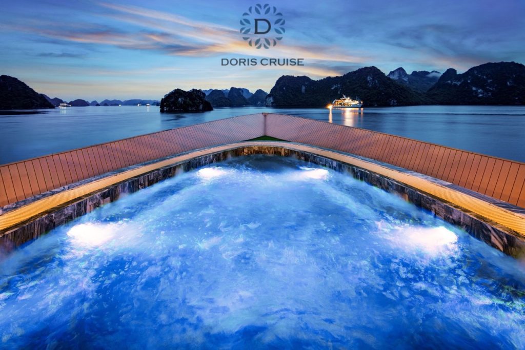 Stunning Halong Bay cruise balcony scene with scenic limestone islands at sunset, perfect for travel.