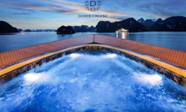 Stunning Halong Bay cruise balcony scene with scenic limestone islands at sunset, perfect for travel.