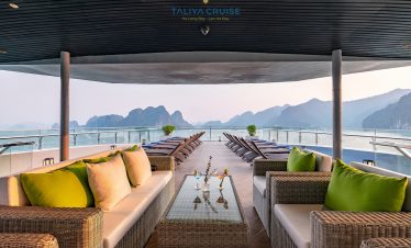 Luxurious cruise balcony overlooking Lan Ha Bay, perfect for relaxing and enjoying stunning seascape.