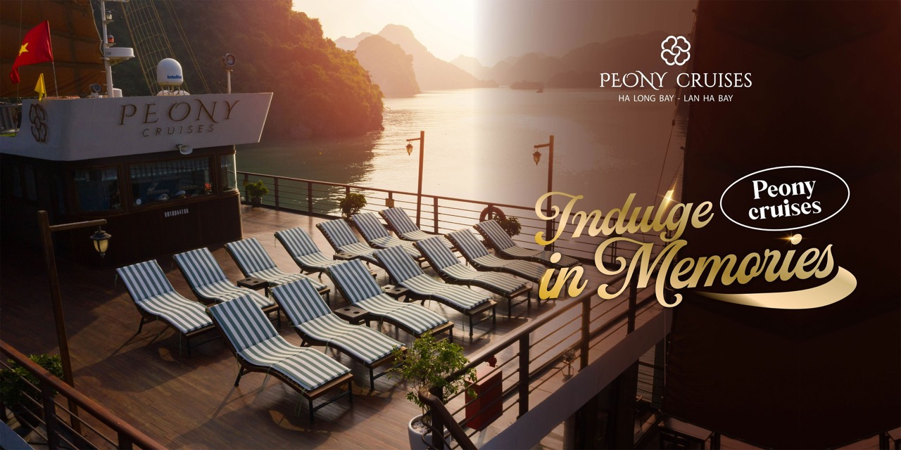 Stunning view of Halong Bay from cruise balcony with relaxing lounge chairs at sunset.