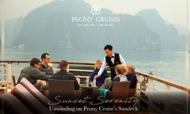 Relaxing cruise balcony view of Halong Bay with passengers enjoying sunset scenery.