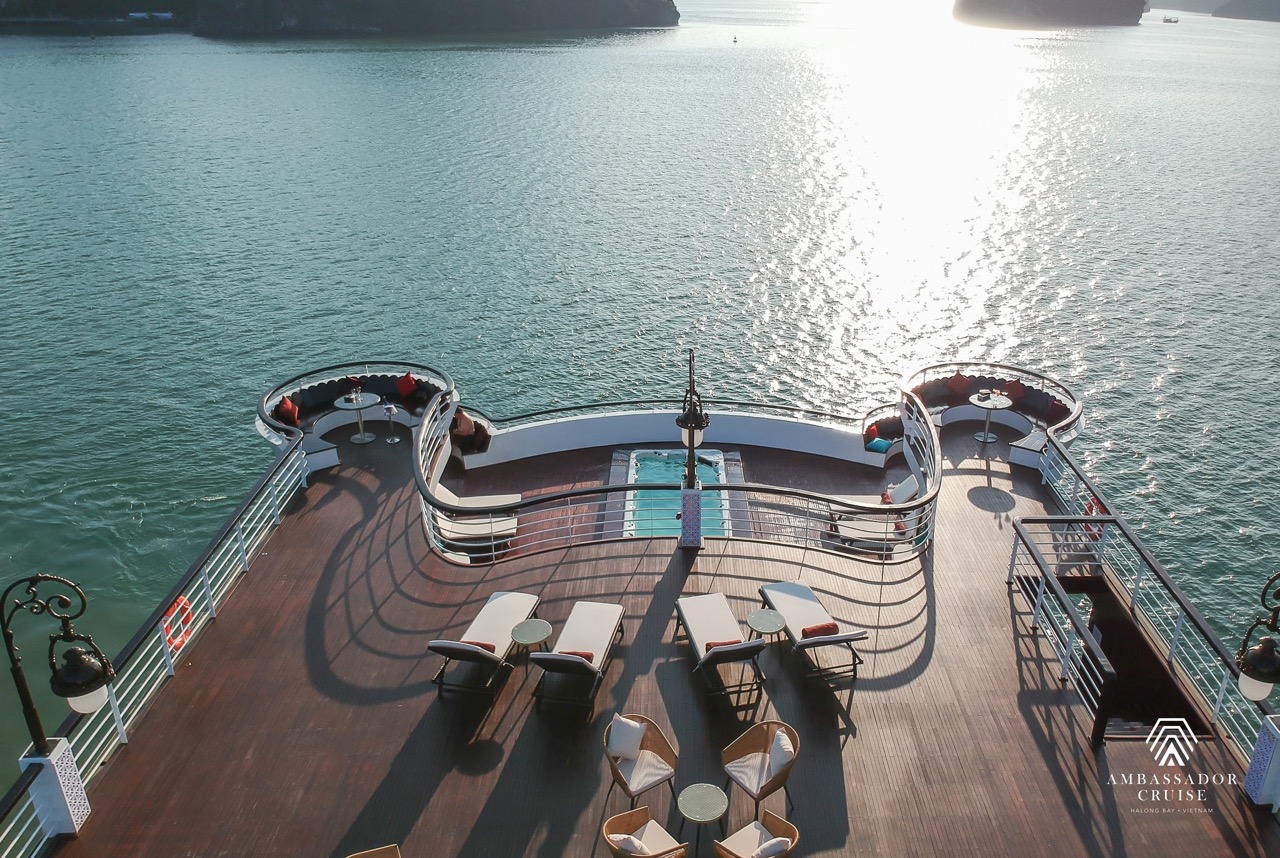 Stunning view from a cruise balcony in Halong Bay, showcasing calm waters and scenic landscape, perf.