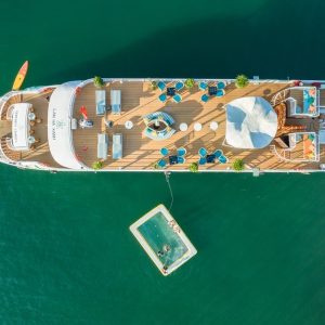 Top-down view of sundeck and floating sea pool.