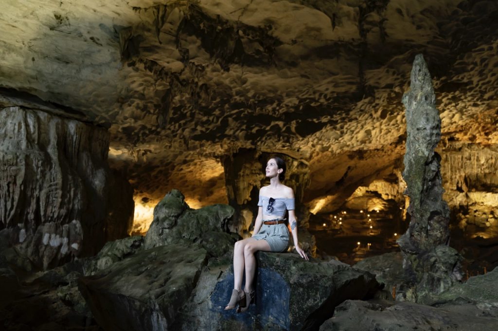 Magnificent woman exploring the stunning Son Doong Cave in Quang Binh, Vietnam.