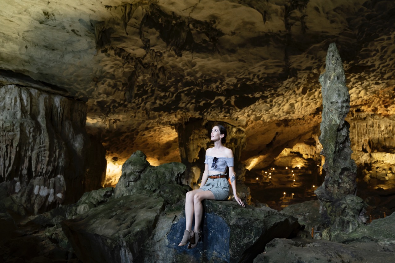 Magnificent woman exploring the stunning Son Doong Cave in Quang Binh, Vietnam.