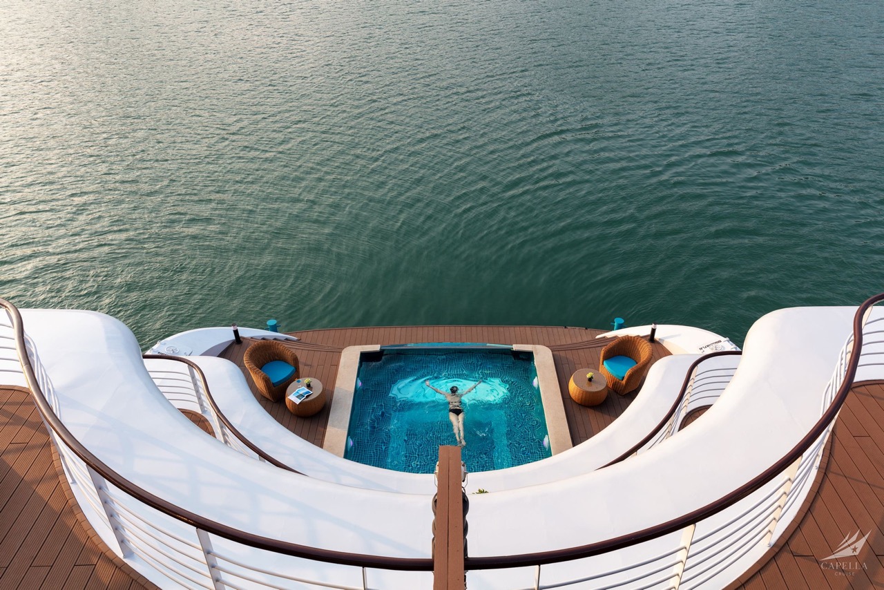 Luxurious boat deck with private pool and scenic waterview, perfect for relaxing vacations.