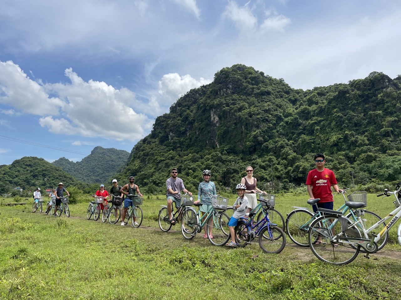 Enjoying scenic cycling tours in Vietnam's lush green mountains and countryside with ViettrendTour.