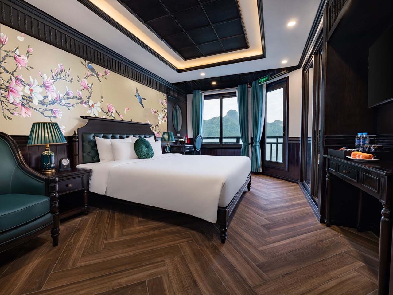 Stunning luxury cruise balcony view of Halong Bay with scenic limestone karsts and tranquil waters.