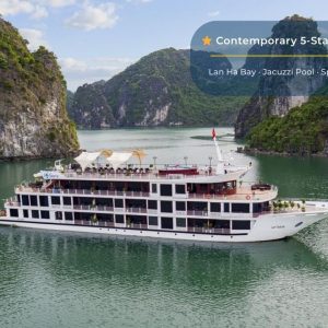Luxury cruise ship on Lan Ha Bay with lush green limestone islands, perfect for Vietnam travel tours.
