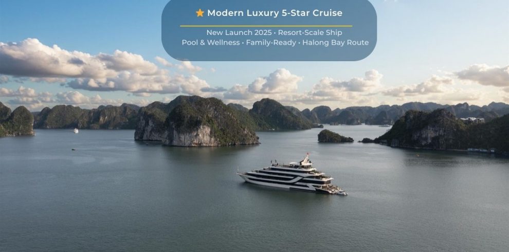 Elegant cruise sailing through Halong Bay's stunning limestone karsts and emerald waters, offering a.