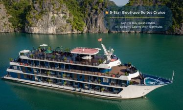 Elegant cruise balcony view of Halong Bay with lush green islands and turquoise waters.