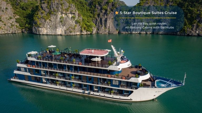 Elegant cruise balcony view of Halong Bay with lush green islands and turquoise waters.