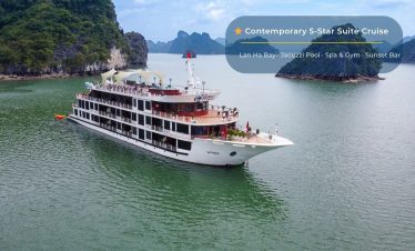 Luxury cruise ship on Lan Ha Bay with scenic limestone islands in Vietnam.