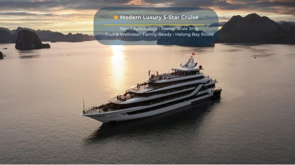 Elegant cruise ship sailing through Halong Bay's stunning limestone karsts at sunset.