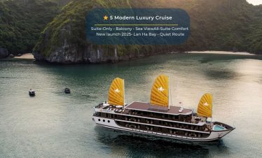 Elegant cruise ship sailing through Lan Ha Bay's tranquil waters, showcasing luxury and scenic beaut.
