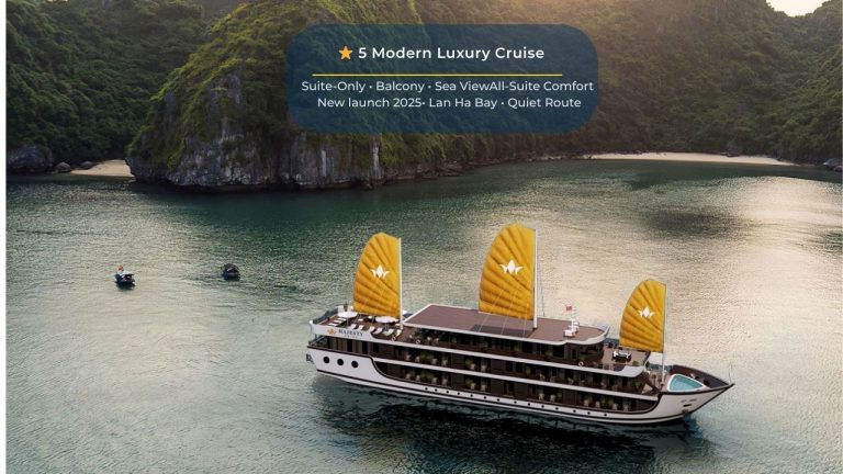 Elegant cruise ship sailing through Lan Ha Bay's tranquil waters, showcasing luxury and scenic beaut.