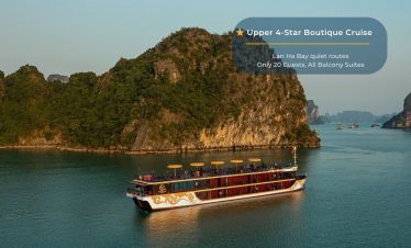 Elegant cruise balcony view of Halong Bay with lush islands and tranquil waters.