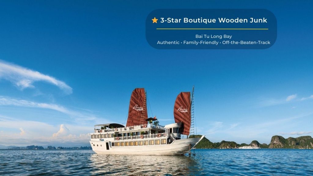Elegant Bai Tu Long Bay cruise ship with traditional sails, offering luxurious experiences amidst st.