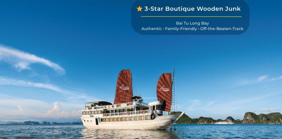 Elegant Bai Tu Long Bay cruise ship with traditional sails, offering luxurious experiences amidst st.