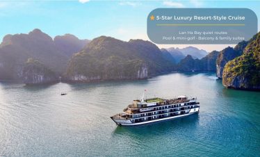 Elegant cruise sailing through stunning Halong Bay with scenic limestone islands and tranquil waters.