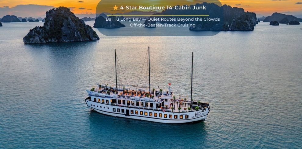 Elegant cruise ship sailing through tranquil Bai Tu Long Bay at sunset, showcasing luxury and scenic.