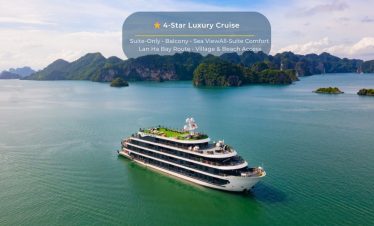 Luxury cruise ship sailing through Halong Bay's emerald waters with scenic limestone karsts.