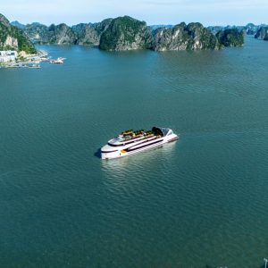 Luxury yacht cruising in Ha Long Bay, Vietnam with scenic limestone karsts.