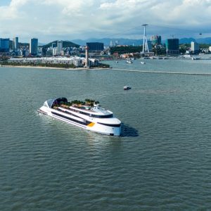 Luxury yacht cruising in the harbor of Ho Chi Minh City, Vietnam.