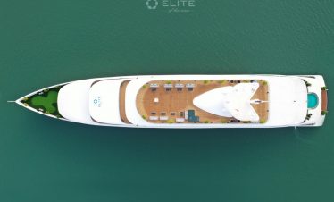 Aerial view of luxury cruise boat on Halong Bay with deck and water scene.
