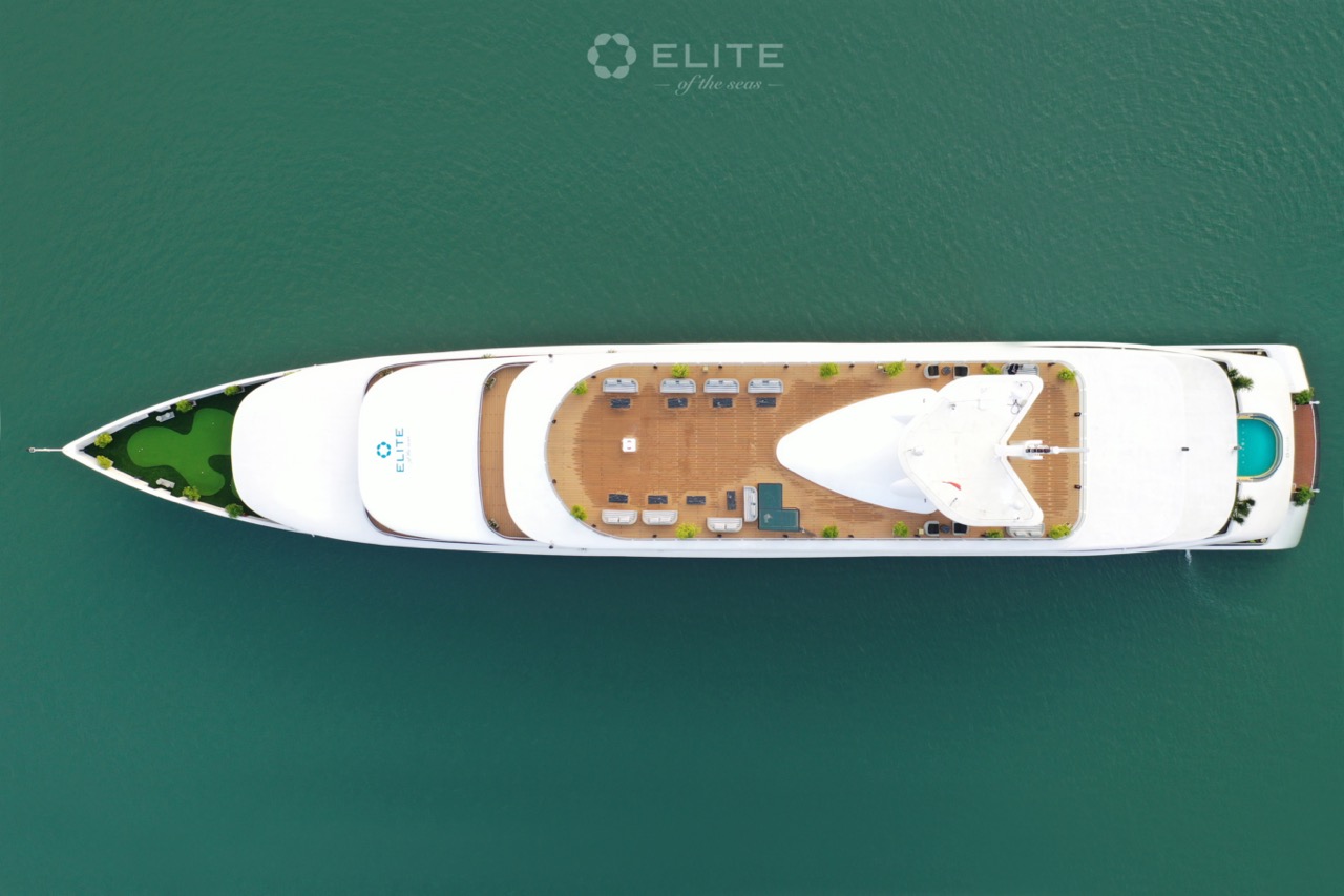 Aerial view of luxury cruise boat on Halong Bay with deck and water scene.