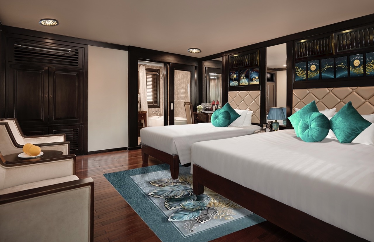 Luxury hotel room with modern decor, comfortable beds, and elegant furnishings in Vietnam.