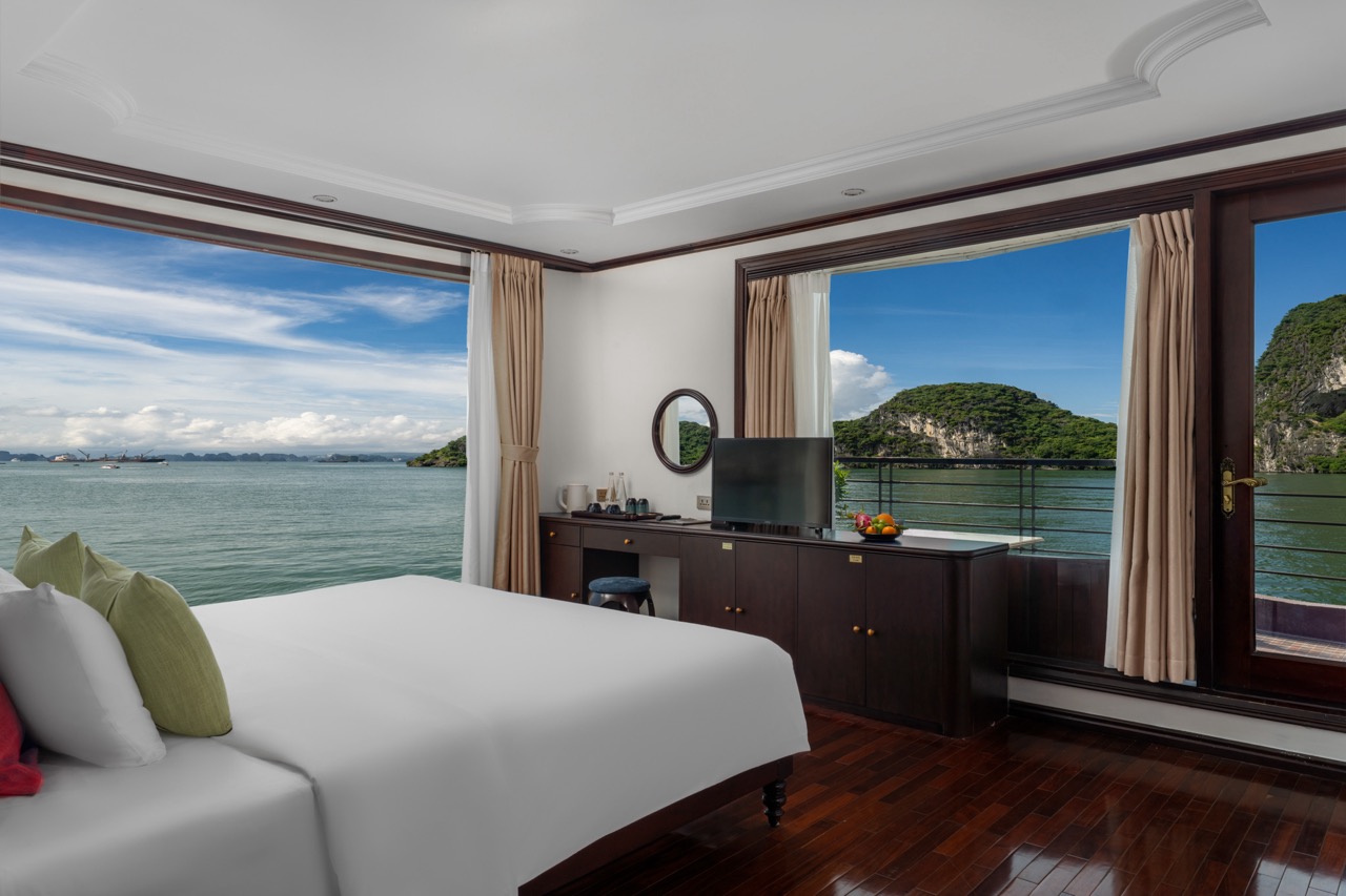 Beautiful Bai Tu Long Bay cruise balcony showcasing stunning seascape and lush islands.
