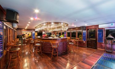 Luxurious interior with bar and seating area, perfect for relaxing after exploring.