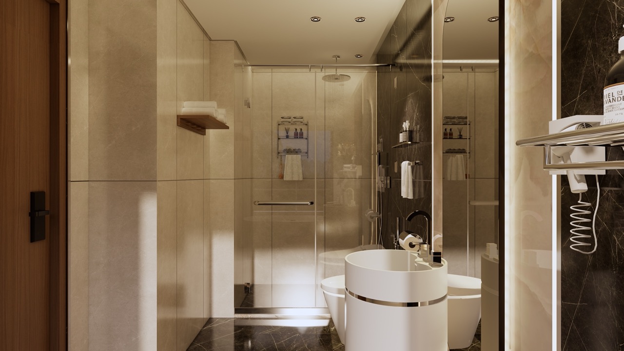 Modern hotel bathroom with glass shower, sleek fixtures, and elegant decor for a luxurious stay.