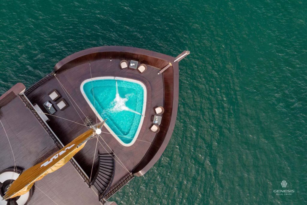 Stunning view of Halong Bay from cruise balcony with private pool, perfect for relaxing and enjoying.