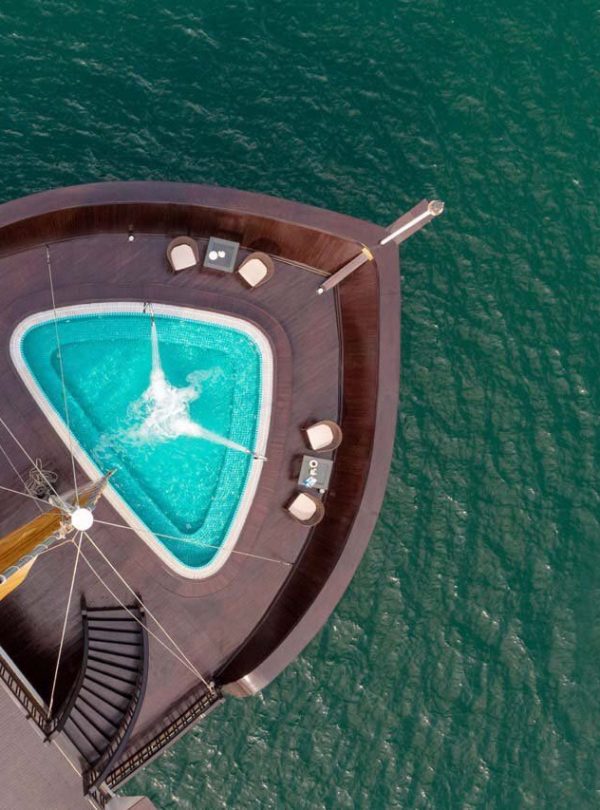 Stunning view of Halong Bay from cruise balcony with private pool, perfect for relaxing and enjoying.